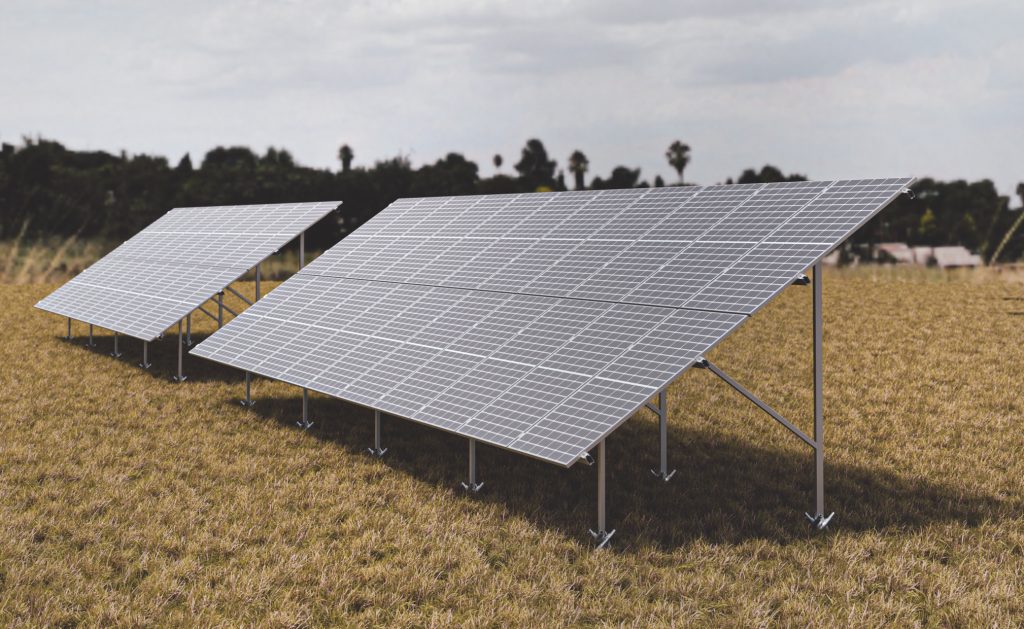 REKOSOLAR ground-mounted solar structure carrying rows of modules in an open field